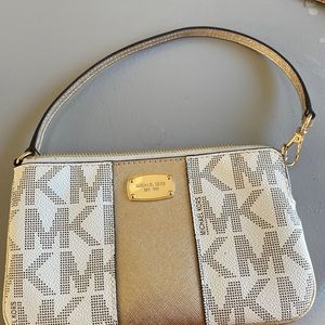Michael Kors small wristlet, beautiful rose gold and light brown color